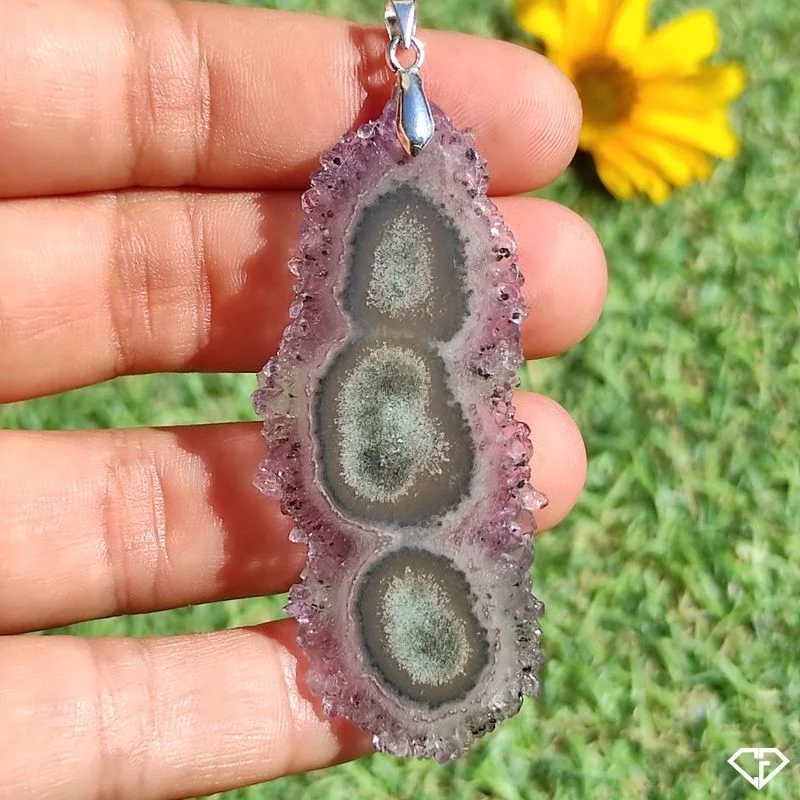 Pendentif tranche de stalactite d'Améthyste